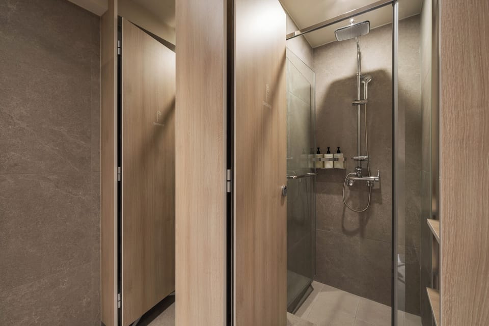 Shower, hair dryer, slippers, towels