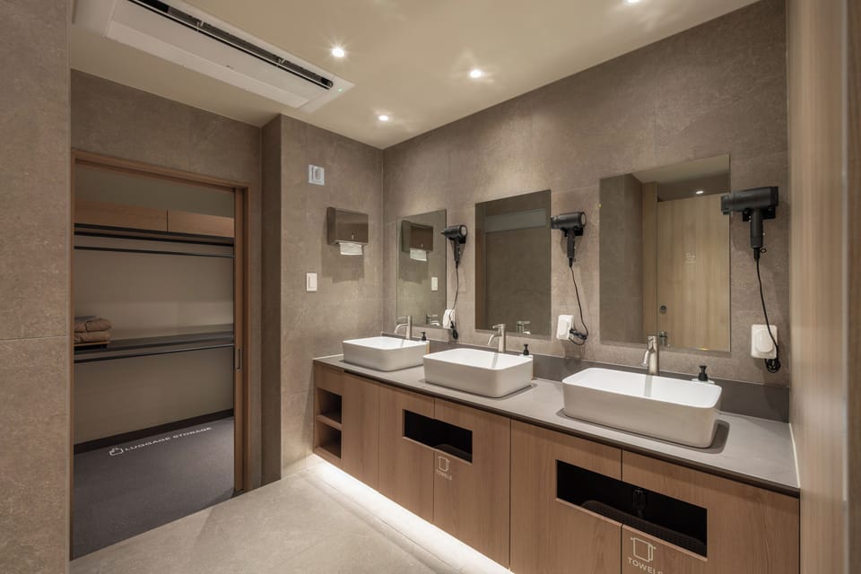 Shower, hair dryer, slippers, towels