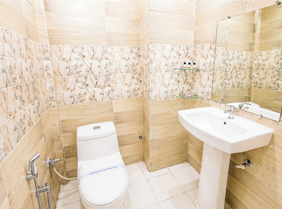 Shower, rainfall showerhead, slippers, towels