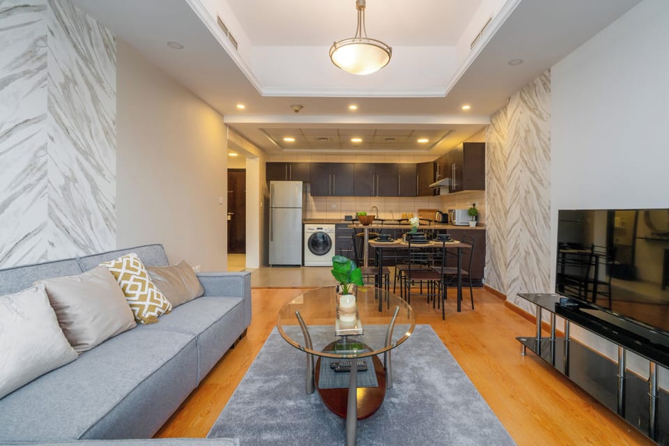 Apartment, City View | Living area | 60-inch flat-screen TV with satellite channels