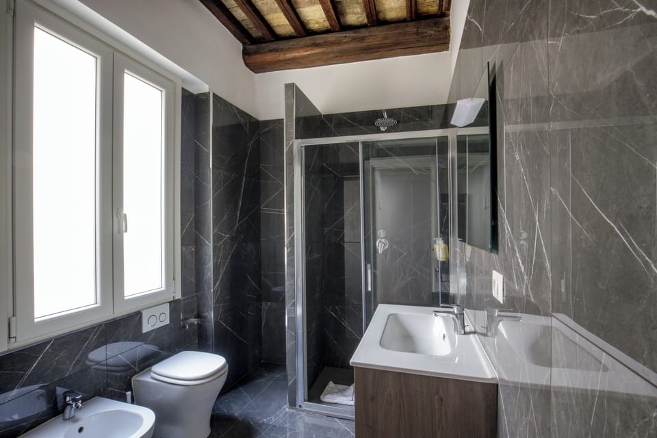 Junior Double Room, City View | Bathroom | Shower, free toiletries, hair dryer, towels