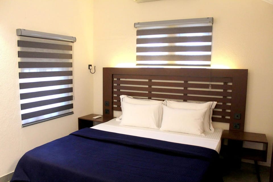 Deluxe Double Room, Patio, Courtyard View | In-room safe, desk, laptop workspace, blackout drapes