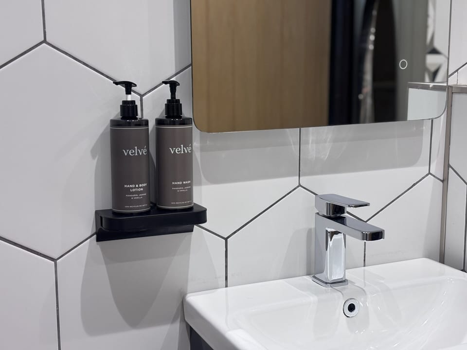Double Room (The W Room) | Bathroom | Hair dryer, towels, soap, shampoo