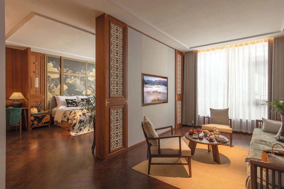Luxury Suite, Courtyard View | Living room | 50-inch LCD TV with cable channels, first-run movies, smart speakers