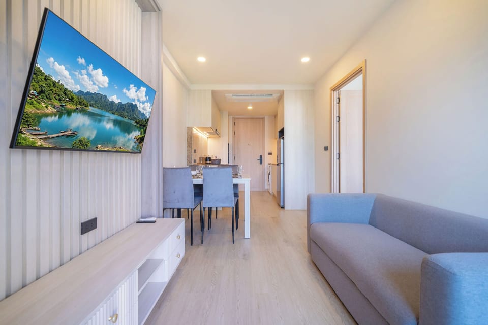 Condo, Balcony, Pool View | Living area | 55-inch flat-screen TV with digital channels
