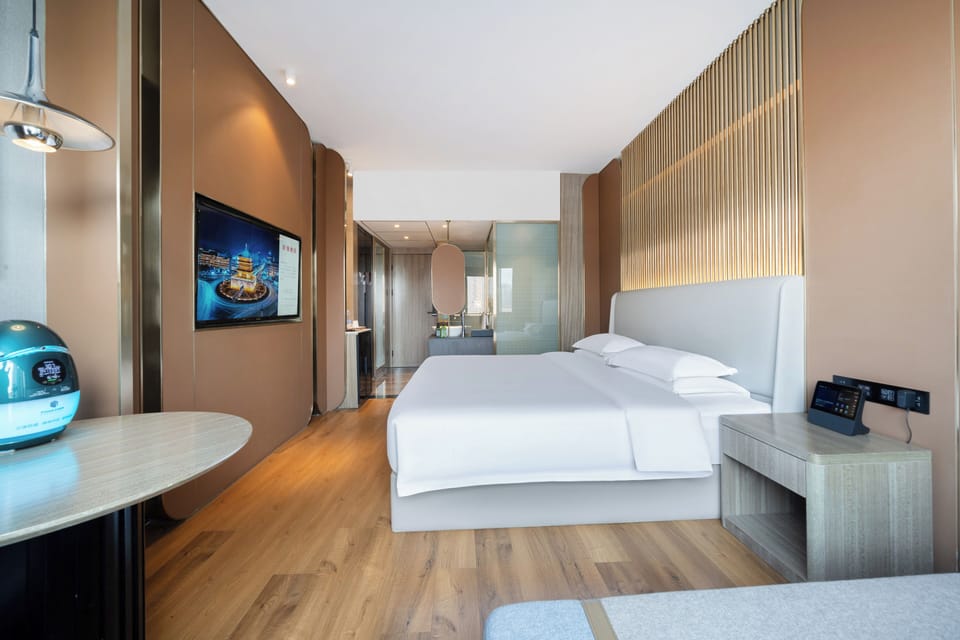 Luxury Double Room, City View | Minibar (some free items), desk, blackout drapes