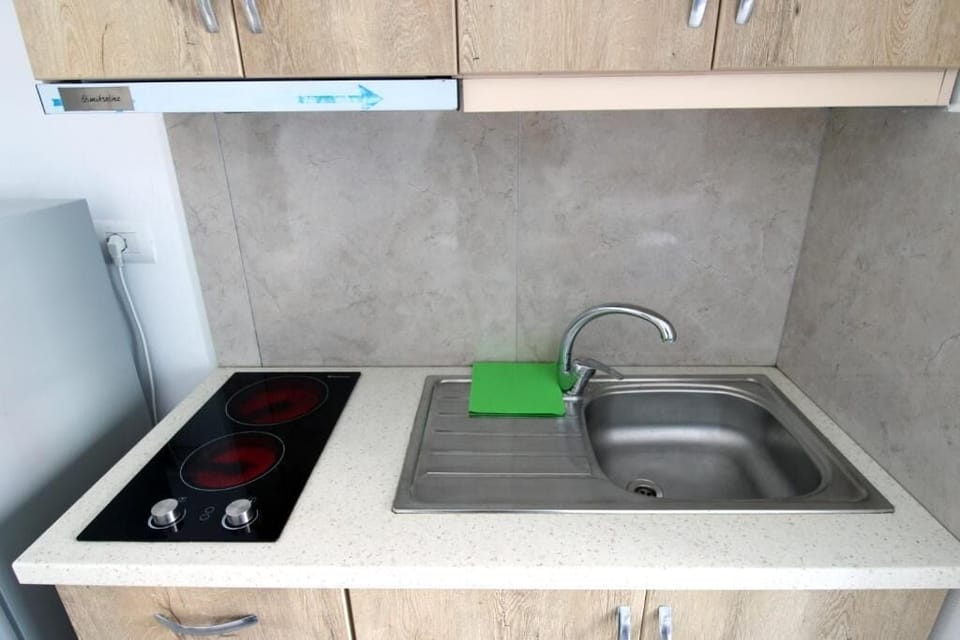 Deluxe Studio, Balcony, City View | Private kitchen | Fridge