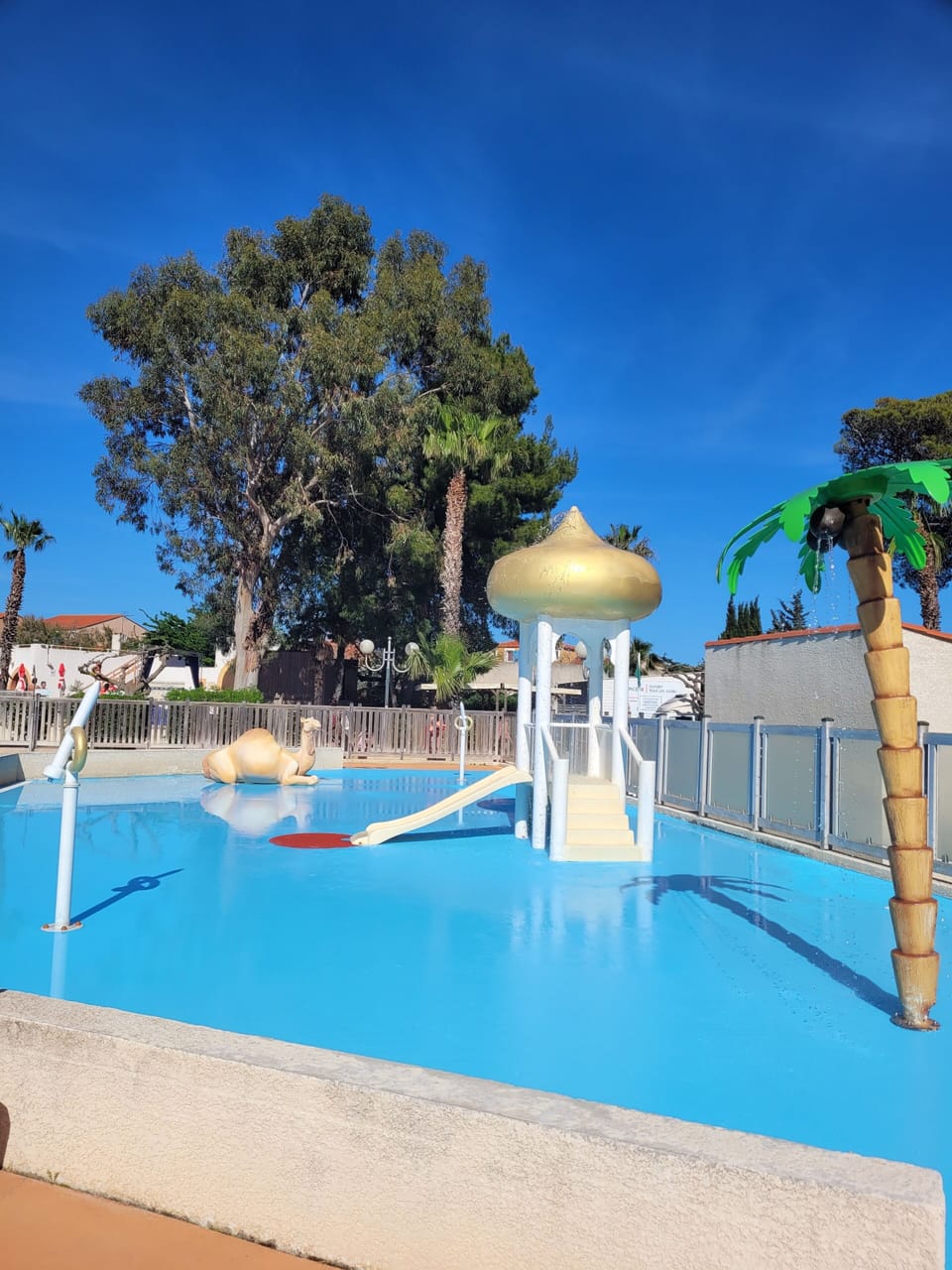 Seasonal outdoor pool, open 10:00 AM to 8:00 PM, pool umbrellas