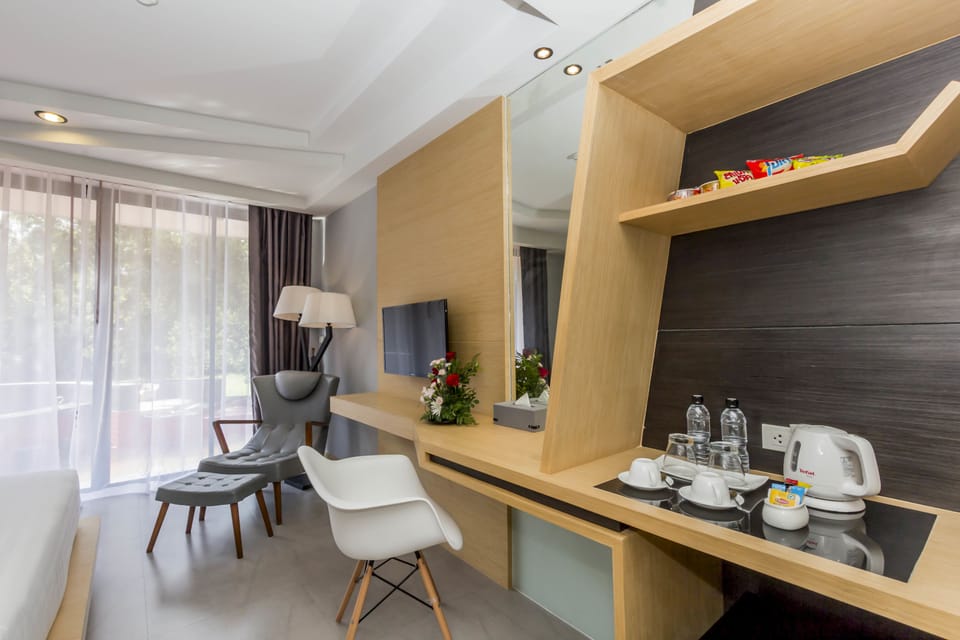 Deluxe Room, 1 Bedroom, Pool Access, Pool View | 1 bedroom, in-room safe, desk, iron/ironing board