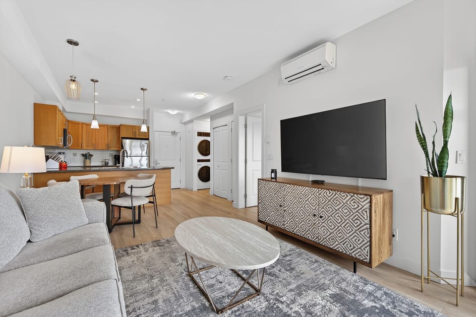 Deluxe Apartment, 1 Bedroom, Pool Access, Partial Lake View | Living area | 55-inch Smart TV with cable channels, streaming services