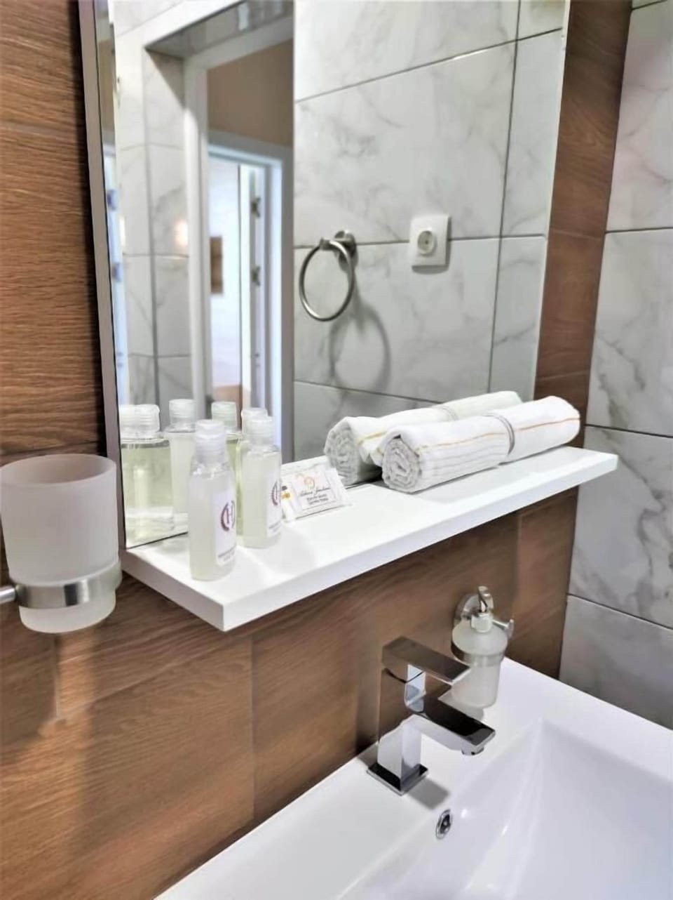Shower, hair dryer, slippers, towels