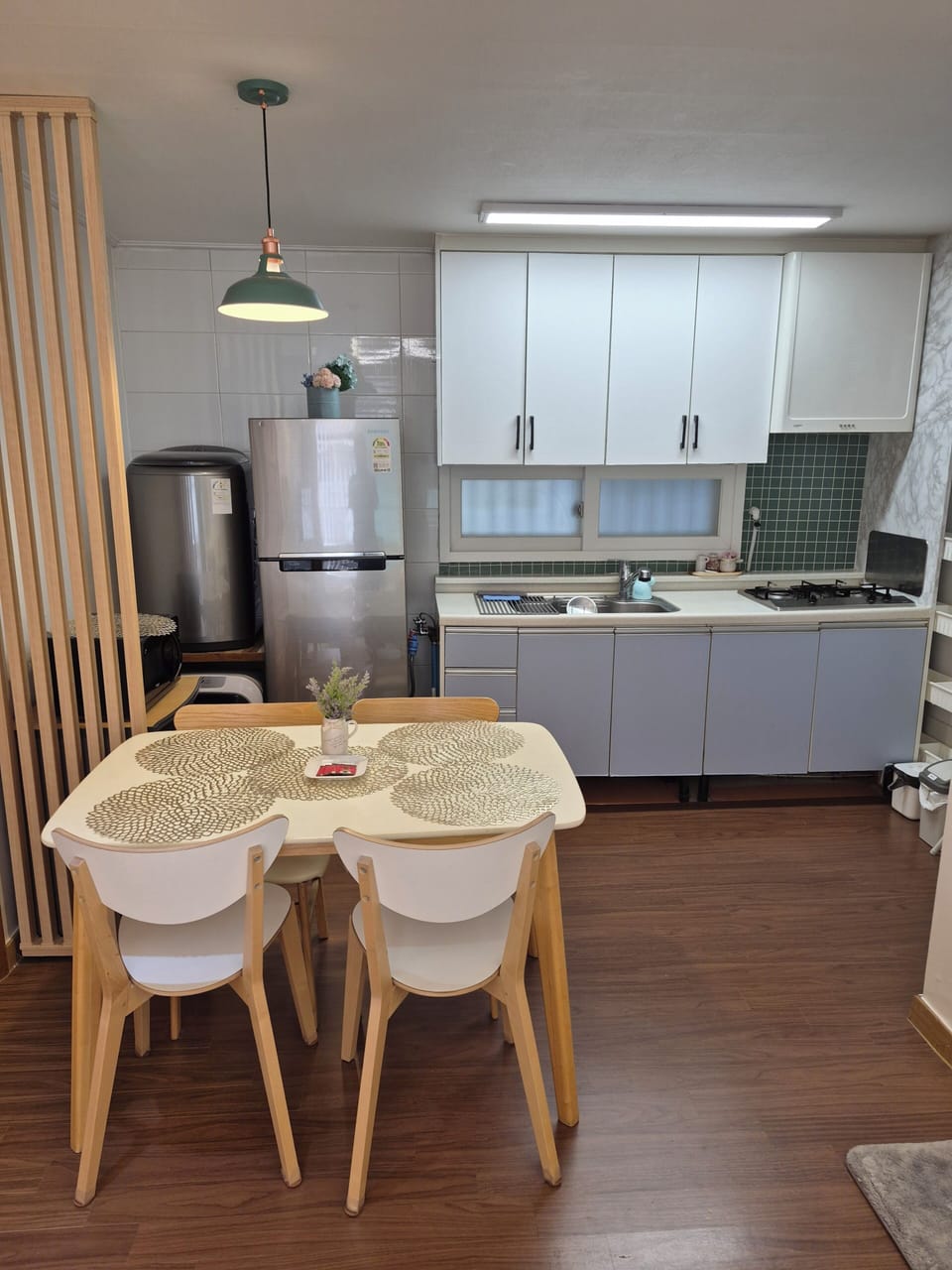 Full-size fridge, rice cooker, cookware/dishes/utensils, spices