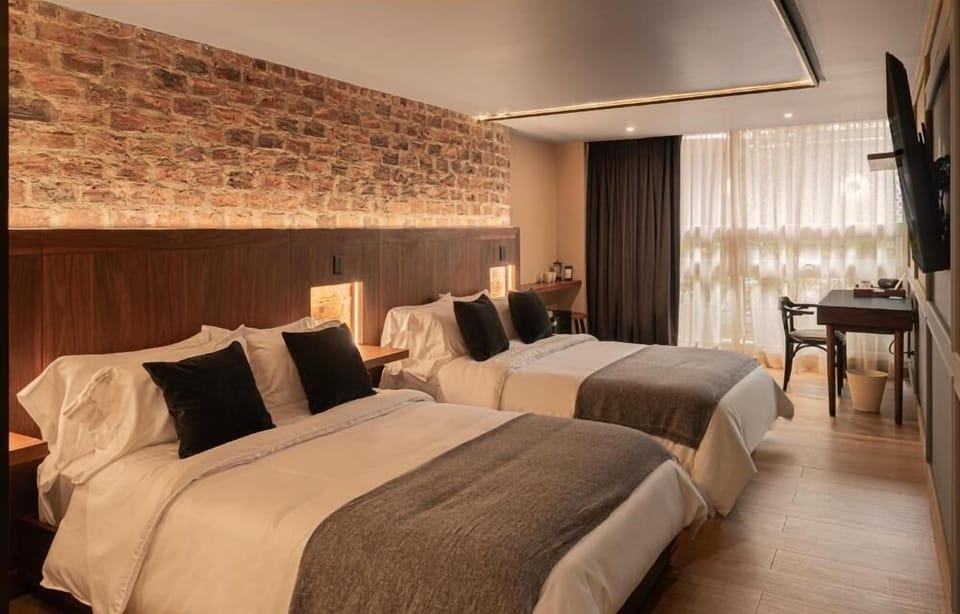 Quadruple Room, City View | Hypo-allergenic bedding available, minibar, blackout drapes