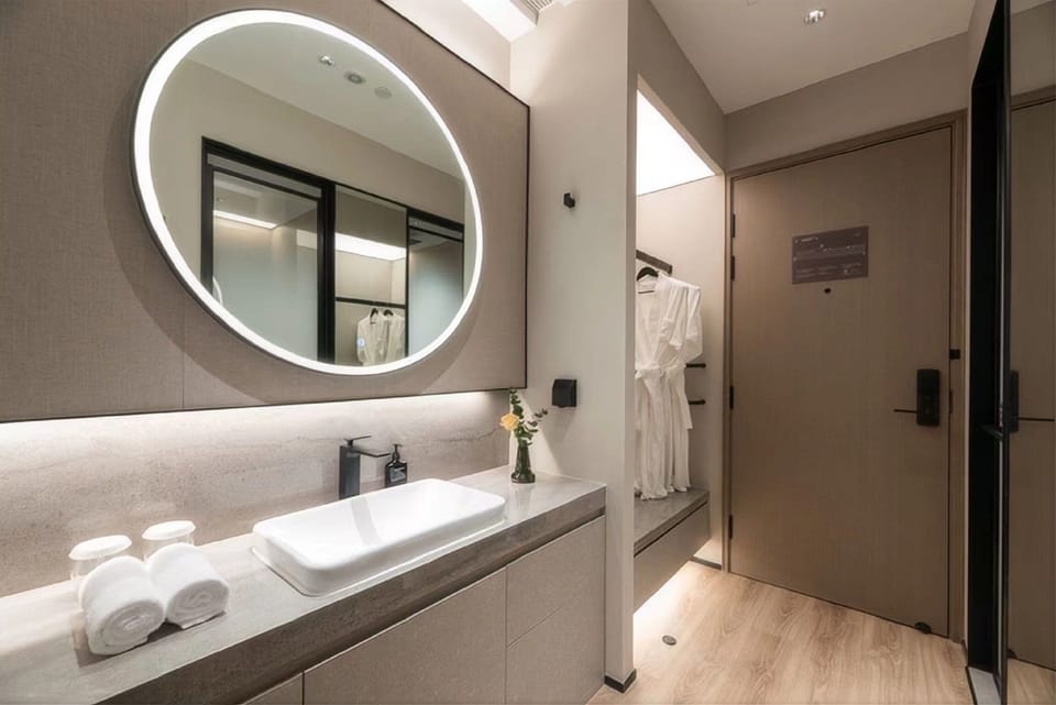 Superior Twin Room | Living area | 65-inch LCD TV with cable channels, pay movies, smart speakers