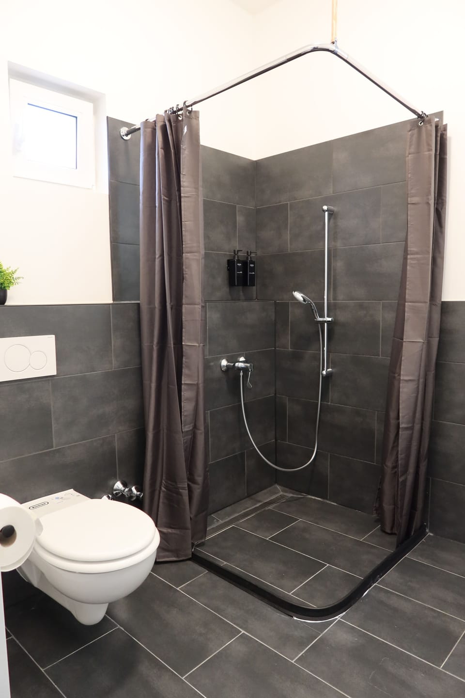 Family Triple Room | Bathroom | Shower, hair dryer, towels, soap