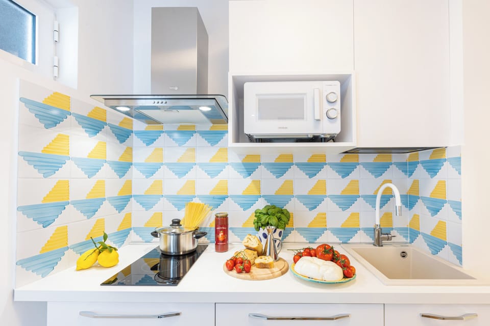 Deluxe Apartment, Sea View | Private kitchen | Mini-fridge, microwave, stovetop, espresso maker