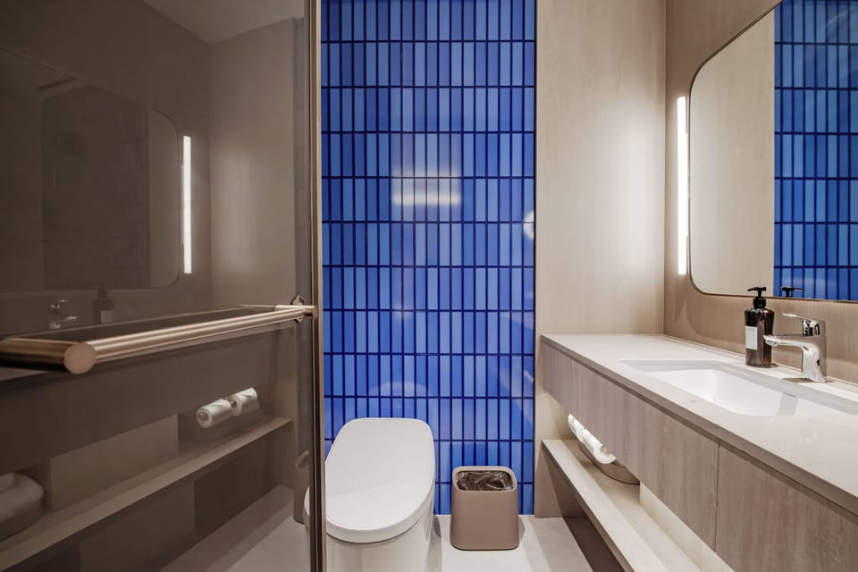 Shower, hair dryer, towels, shampoo