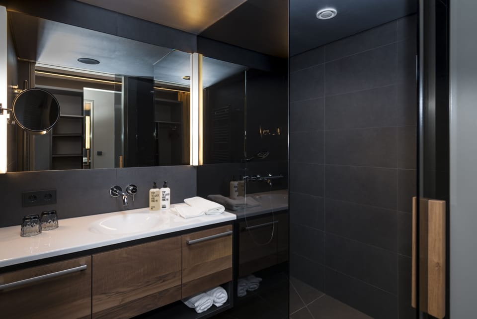 Shower, designer toiletries, bathrobes, slippers