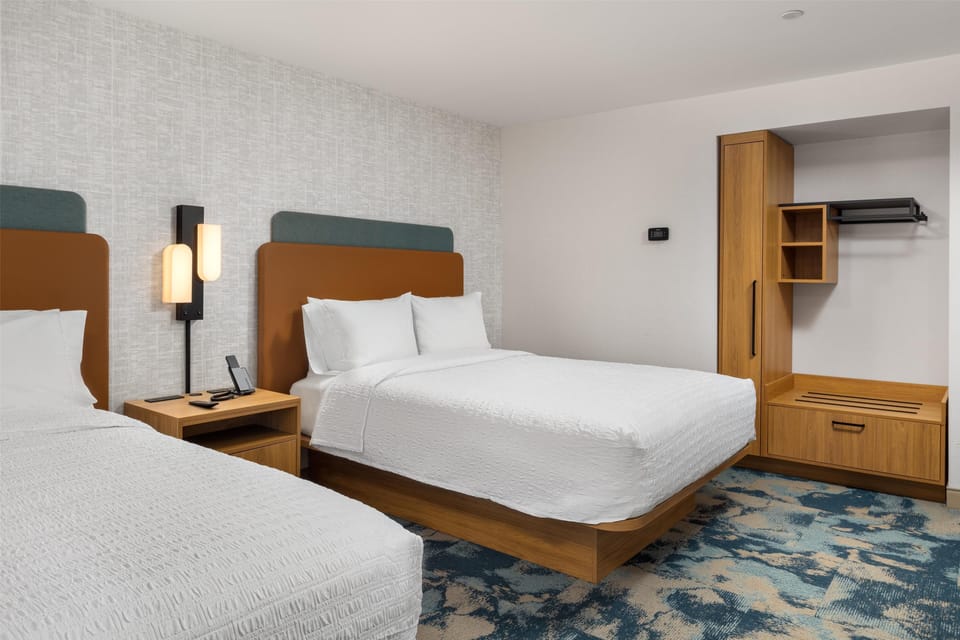 Premium bedding, Tempur-Pedic beds, desk, laptop workspace