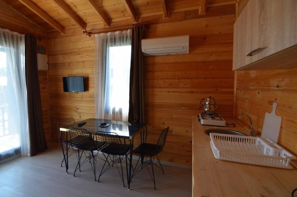 Basic Bungalow, Patio | Private kitchen | Mini-fridge, stovetop, cookware/dishes/utensils