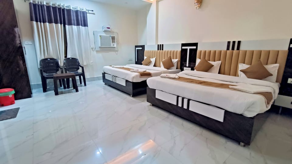 Deluxe Quadruple Room | Premium bedding, desk, laptop workspace, soundproofing