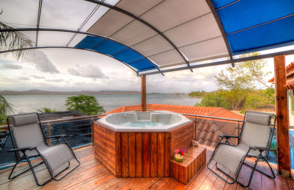 Deluxe Villa, 1 Bedroom, Hot Tub, Bay View | Minibar, individually decorated, individually furnished, blackout drapes