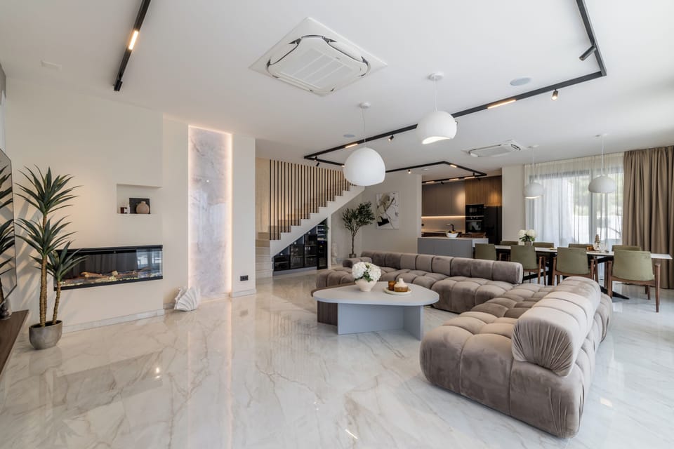 Luxury Villa, Balcony, Sea View | Living area | 55-inch flat-screen TV with cable channels, books