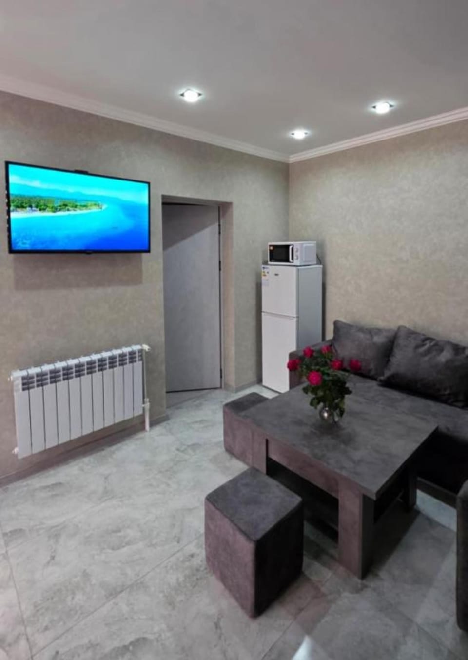Signature Apartment, 2 Bedrooms | Living room | 50-inch Smart TV with digital channels