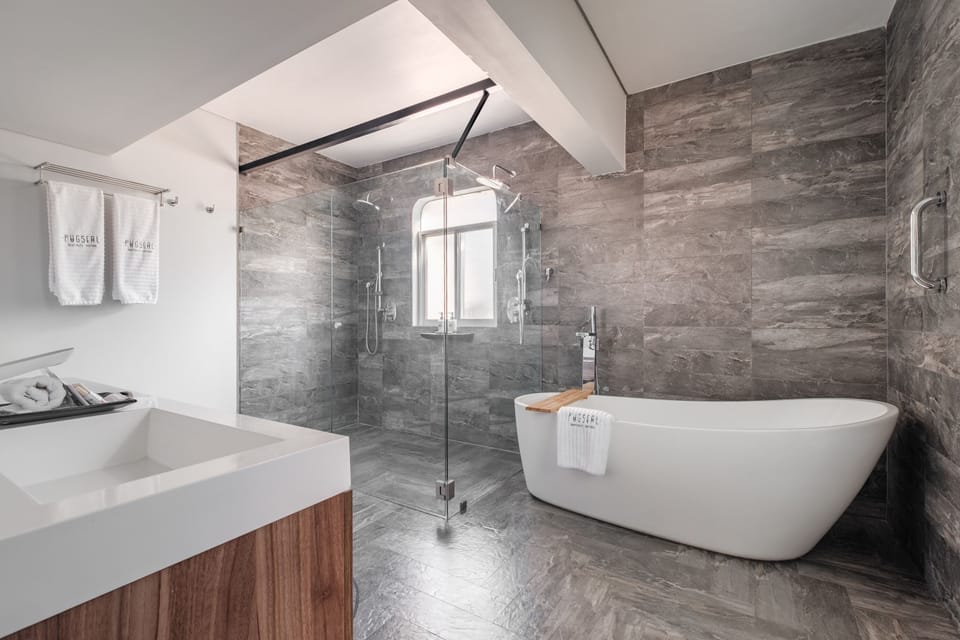 Master Suite | Bathroom | Shower, free toiletries, slippers, towels