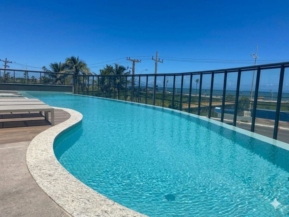 Comfort Apartment, Beach View | Pool | 4 outdoor pools, pool umbrellas, sun loungers