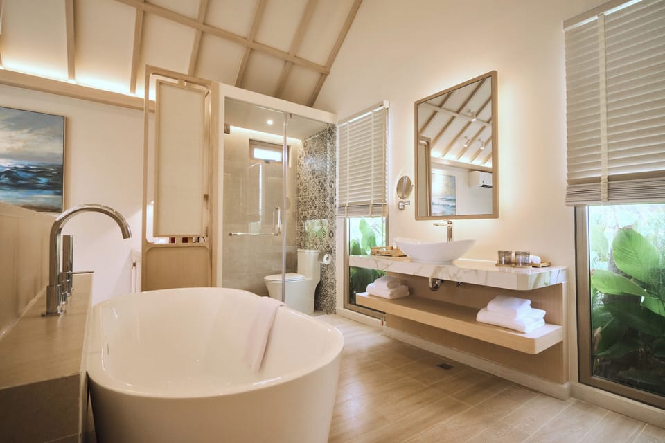 Bungalow, 1 King Bed, Sea View, Beachside | Bathroom | Separate tub and shower, hair dryer, bathrobes, slippers