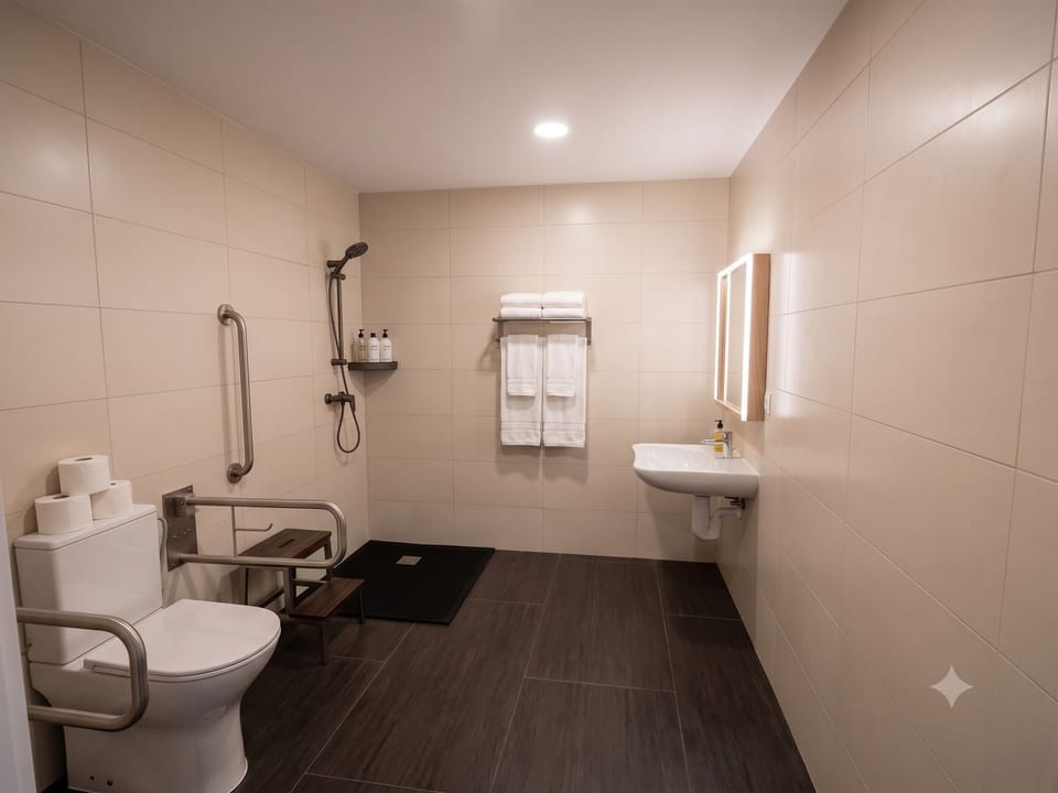 Family Room | Bathroom | Shower, rainfall showerhead, hair dryer, towels
