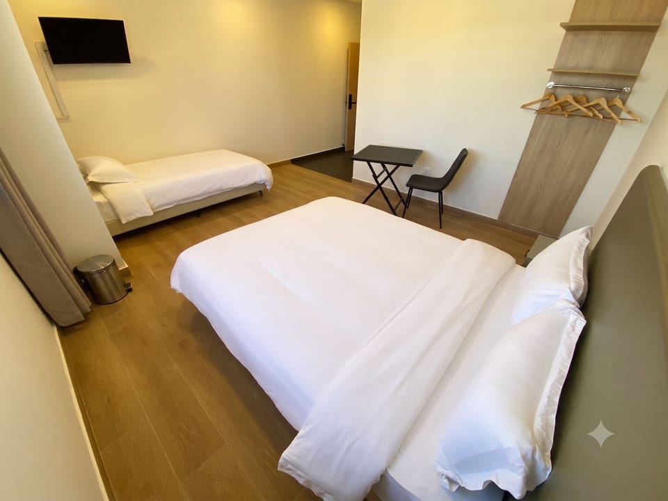 Family Room | Premium bedding, down comforters, desk, laptop workspace