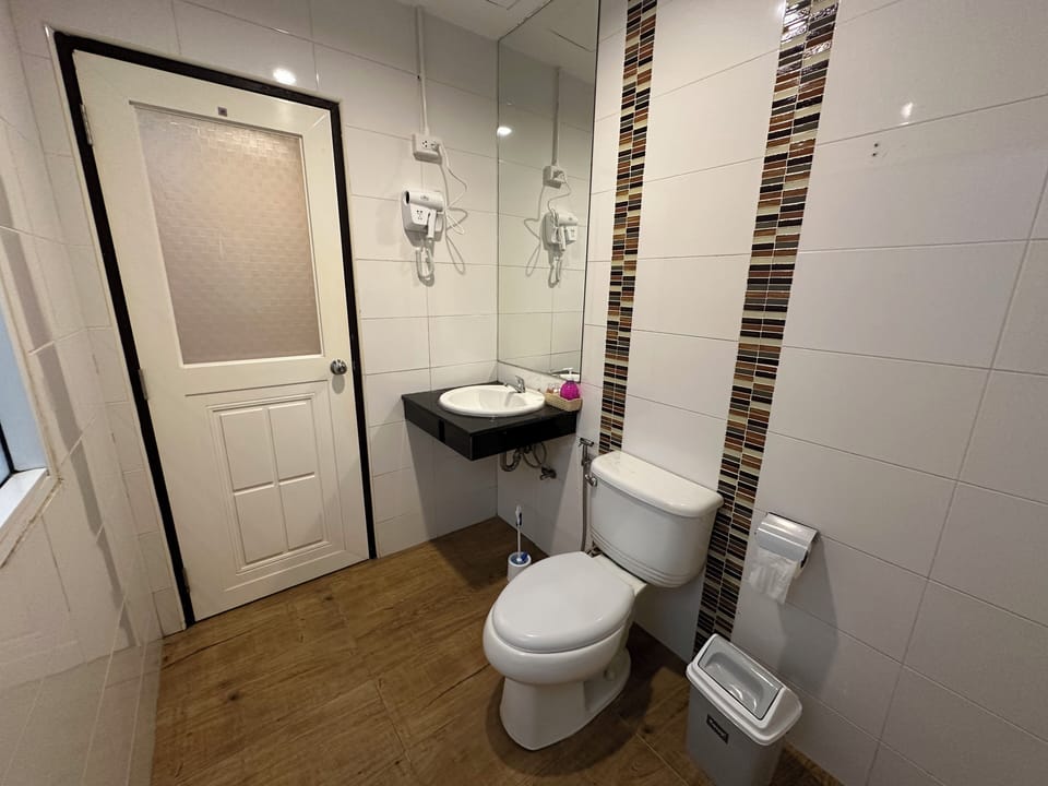 Family Triple Room, Balcony | Bathroom | Shower, hair dryer, towels, soap