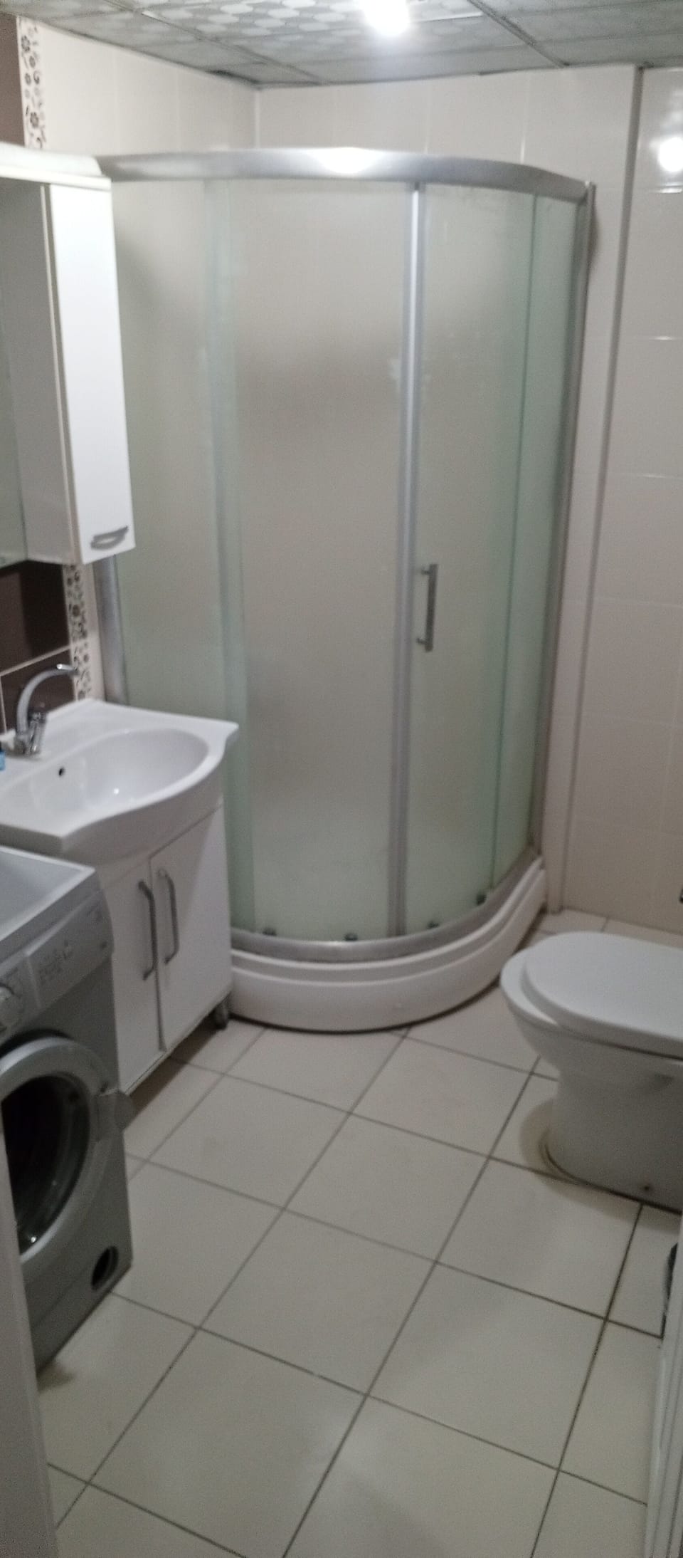 Shower, hair dryer, slippers, towels