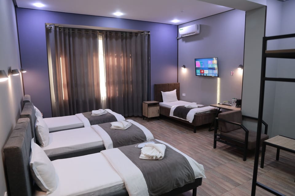 Standard Quadruple Room, City View | Desk, laptop workspace
