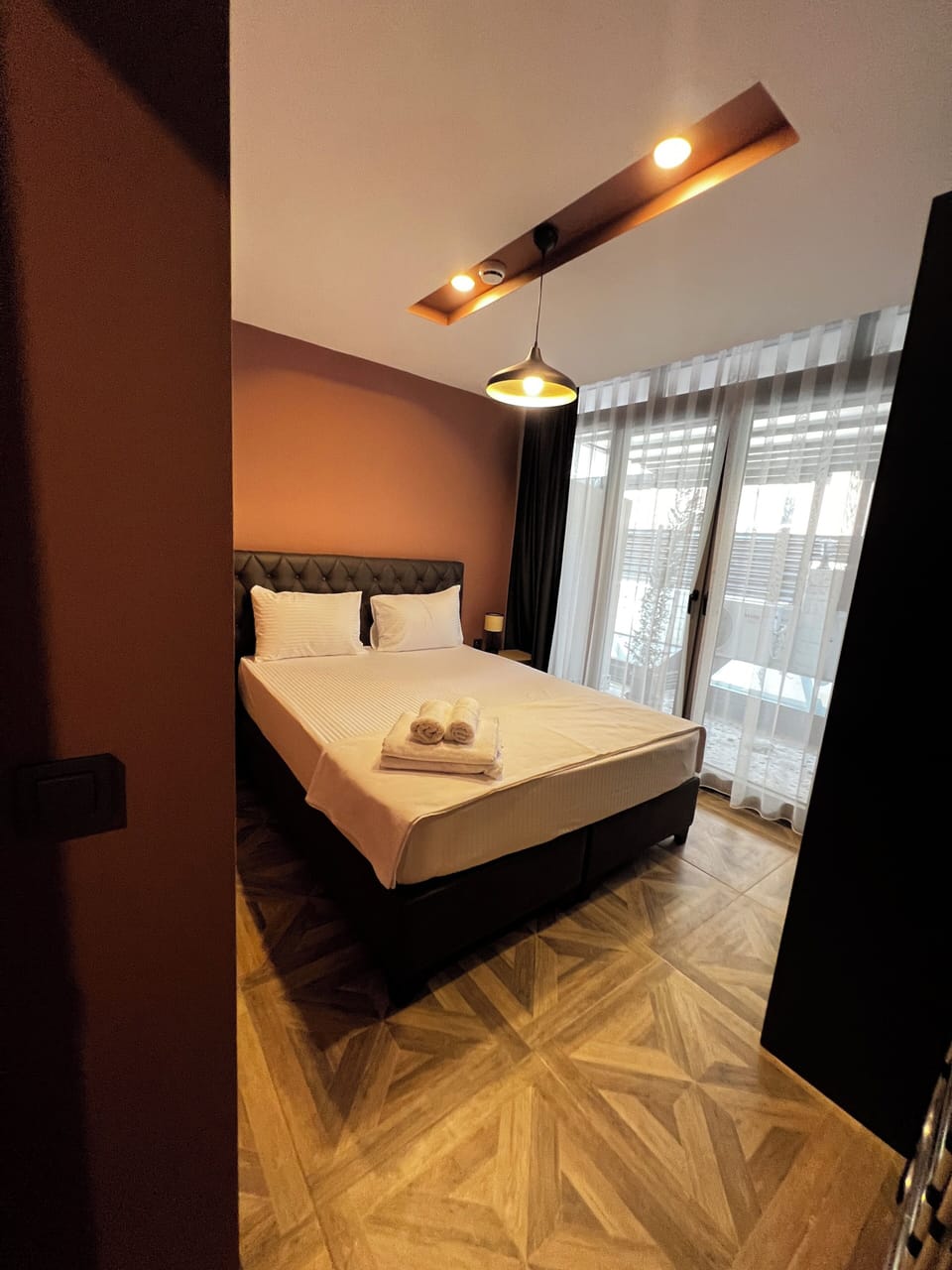 Deluxe Apartment, Non Smoking, City View | Desk, laptop workspace, blackout drapes, iron/ironing board