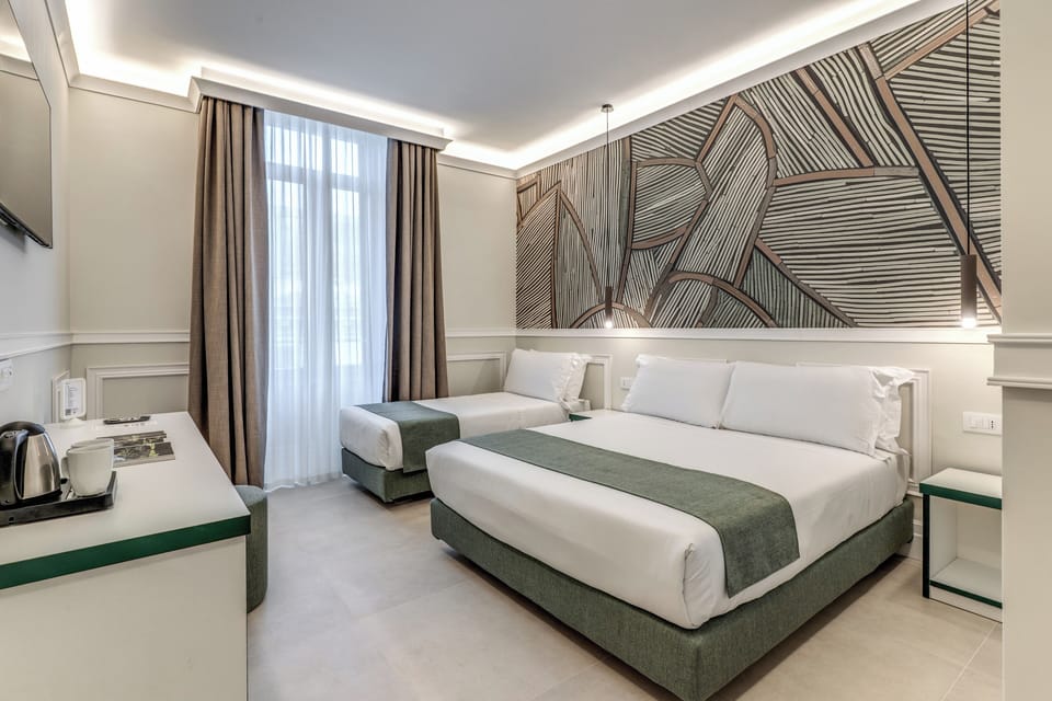 Deluxe Triple Room | In-room safe, desk, laptop workspace, blackout drapes