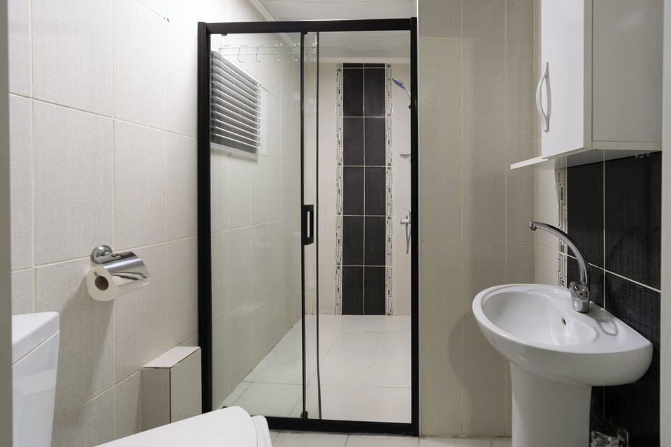 Classic Double Room, City View | Bathroom | Shower, hair dryer, slippers, towels