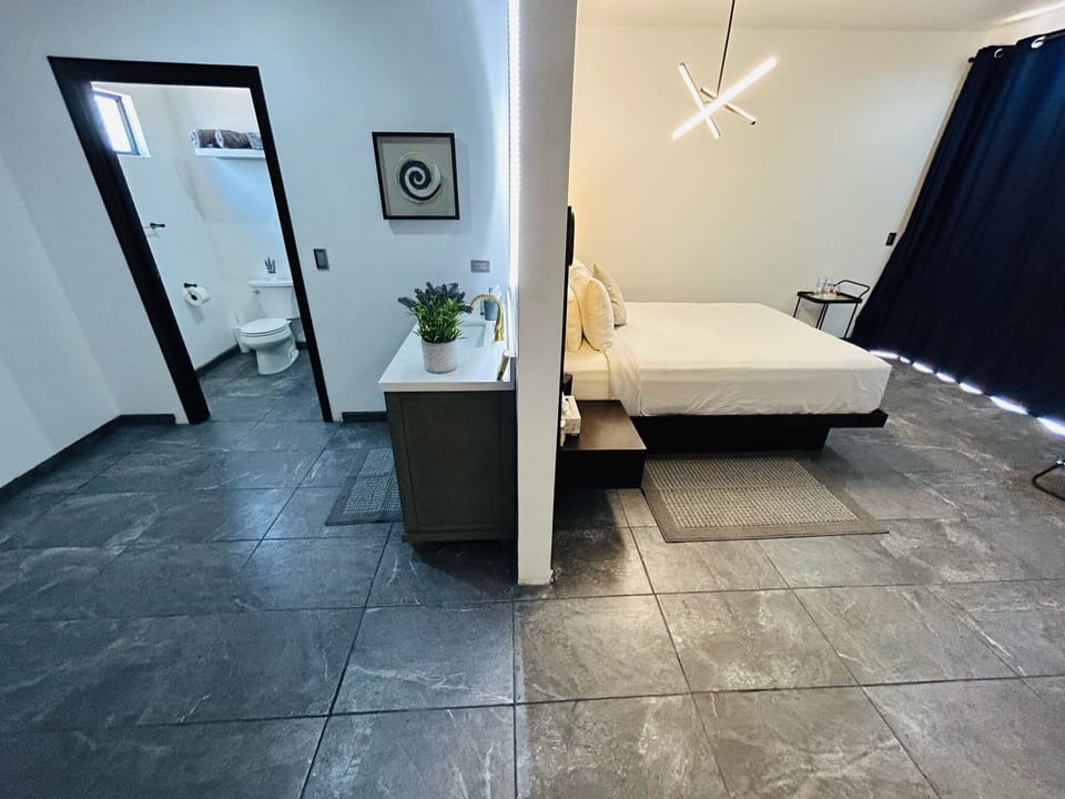 Deluxe Suite, Garden View | Iron/ironing board, free WiFi