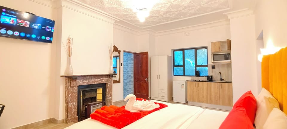 Luxury Apartment, Garden View | In-room safe, desk, laptop workspace, iron/ironing board