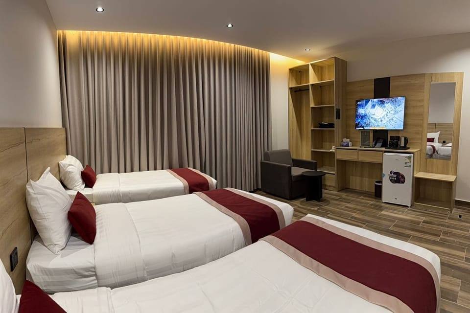 Triple Room, City View | Blackout drapes, soundproofing, iron/ironing board, WiFi (free)
