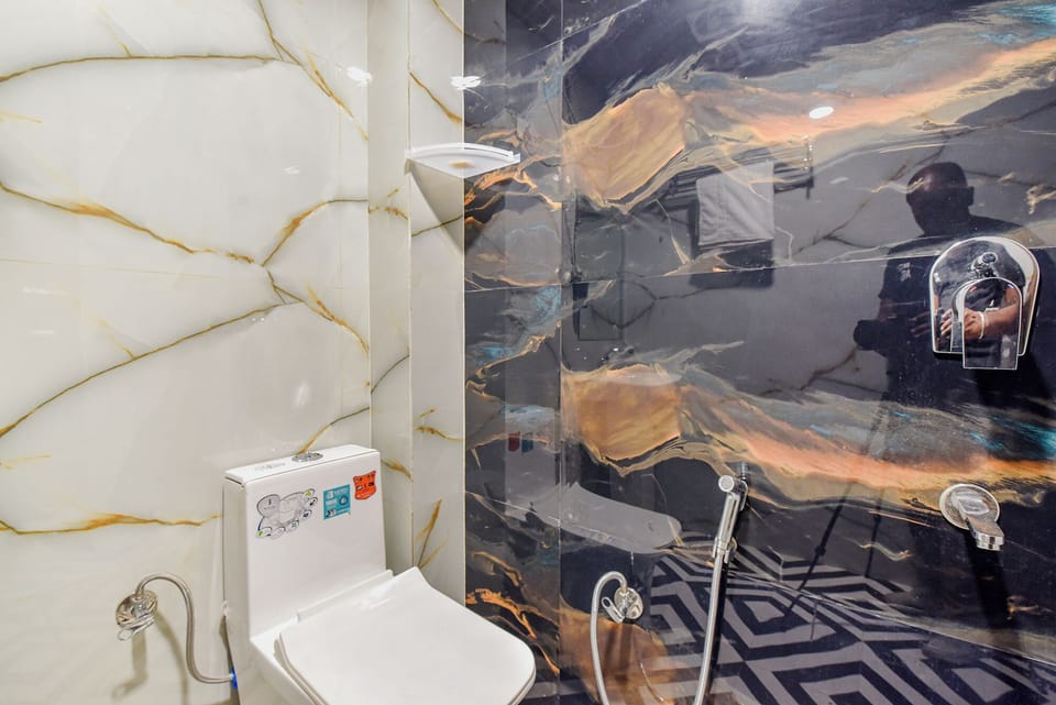 Shower, rainfall showerhead, towels, toilet paper