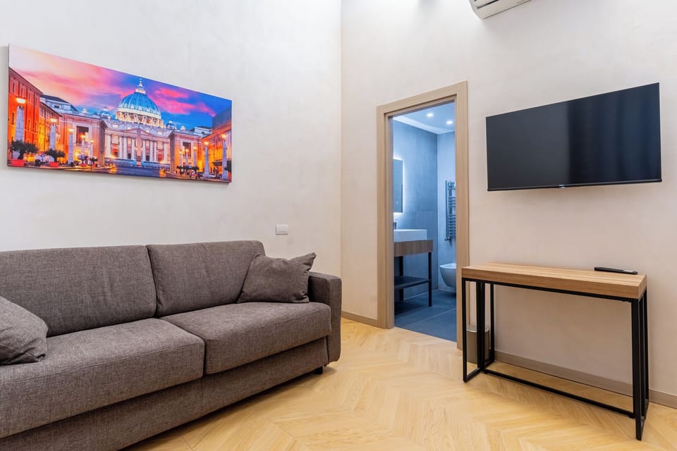 Deluxe Suite, City View | Living area | 45-inch Smart TV with cable channels