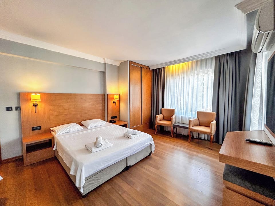 Standard Triple Room, Balcony | Desk, laptop workspace, iron/ironing board, free WiFi