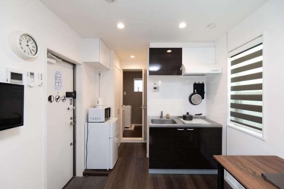 Mini-fridge, microwave, stovetop, cookware/dishes/utensils