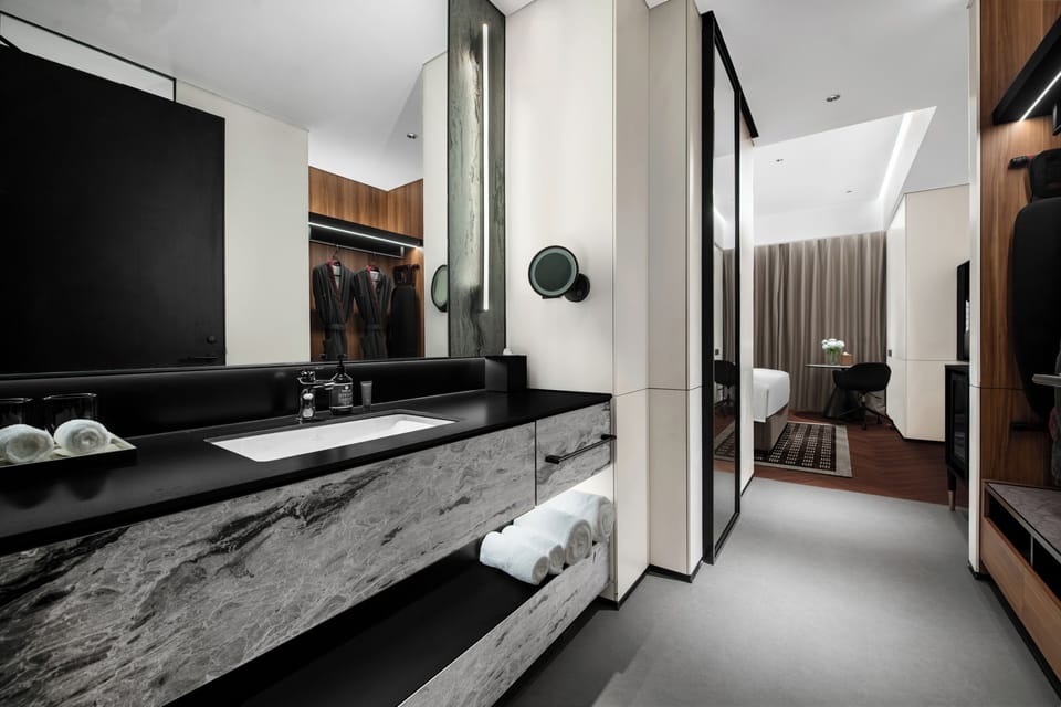Basic Single Room, City View | Bathroom | Designer toiletries, hair dryer, bathrobes, towels
