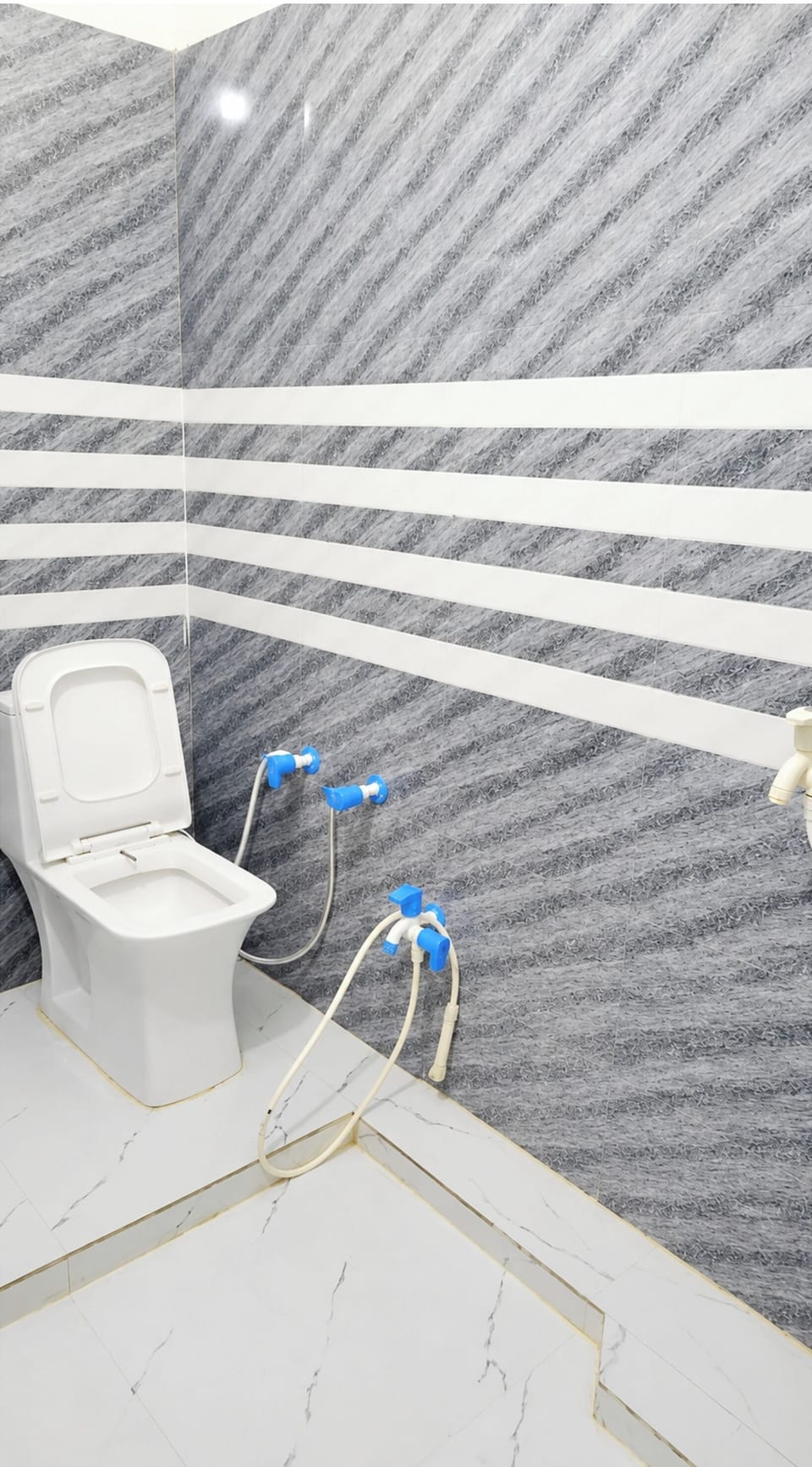 Shower, rainfall showerhead, slippers, towels