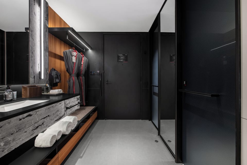 Shower, hair dryer, slippers, towels