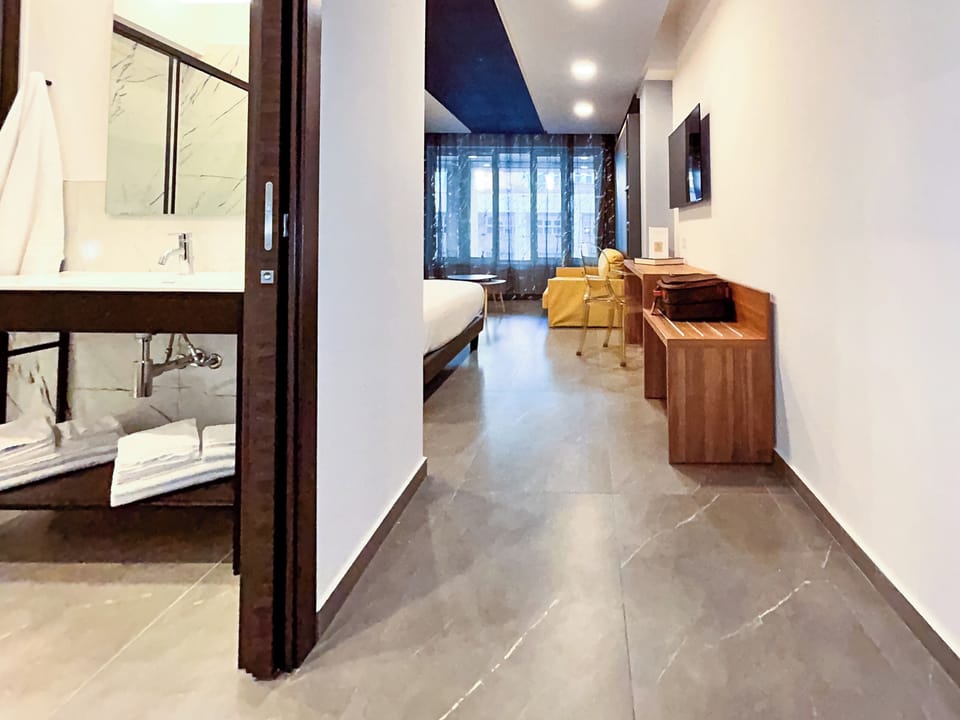 Superior Quadruple Room, City View | In-room safe, laptop workspace, blackout drapes, free WiFi